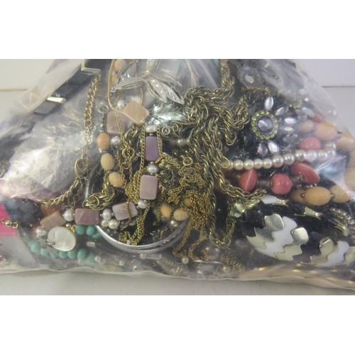 298 - 10kg bag of unsorted costume jewellery.