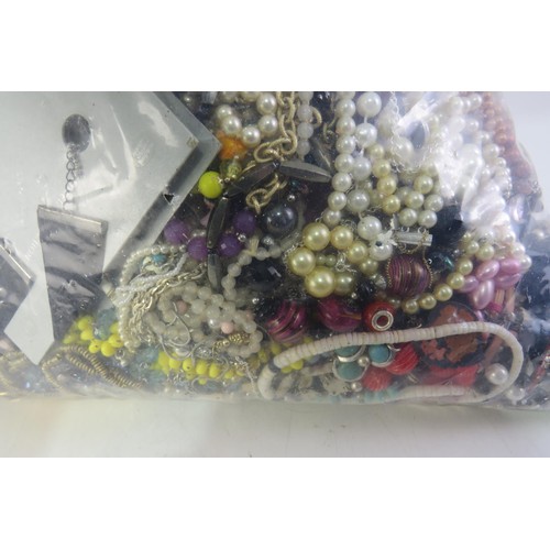 298 - 10kg bag of unsorted costume jewellery.