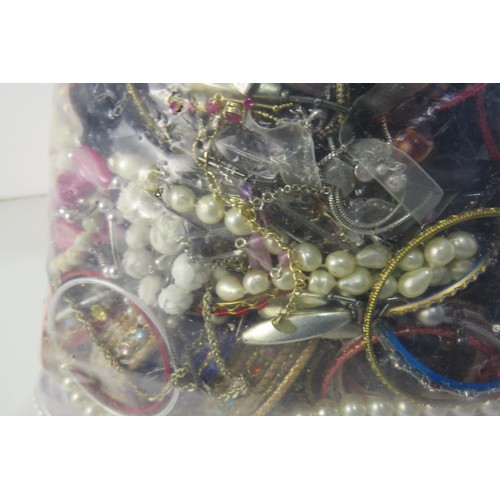 299 - 10kg bag of unsorted costume jewellery.