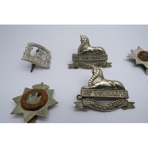 34 - 15 Military Cap/Regiment Badges