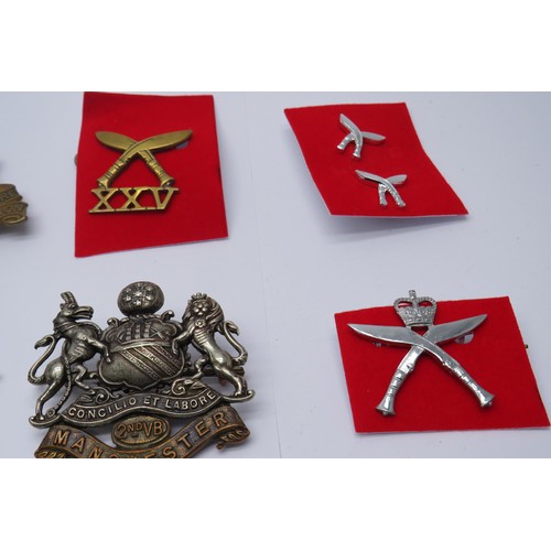 61 - 12 Military cap/Regiment badges