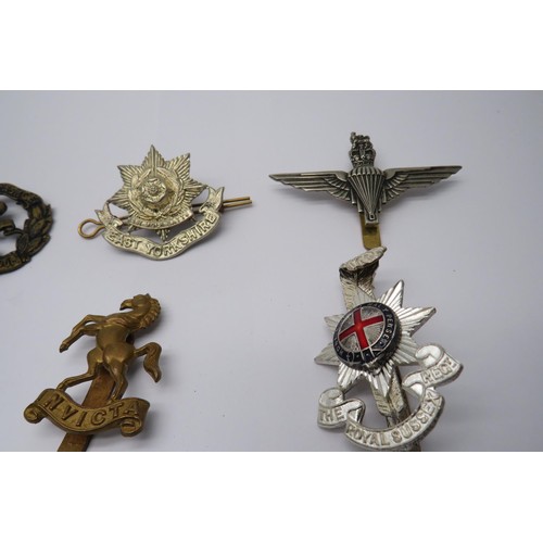 38 - 17 Military Cap/Regiment Badges