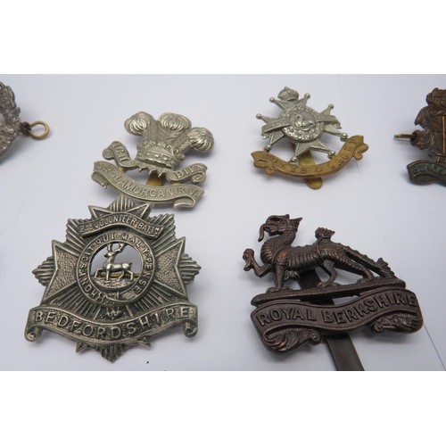 39 - 16 Military Cap/Regiment Badges