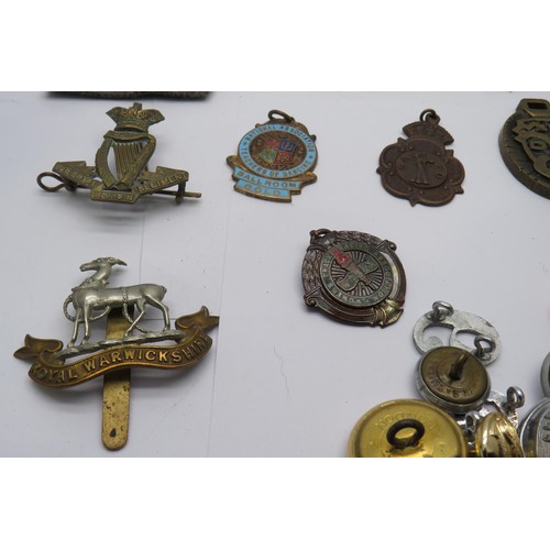 57 - Job lot of military badges and buttons