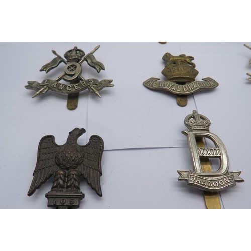 47 - 15 Military Cap/Regiment Badges