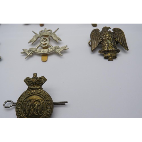 47 - 15 Military Cap/Regiment Badges