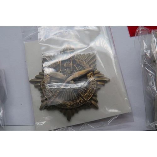 55 - 20 Military Cap/Regiment badges