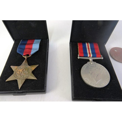 533 - WWII Atlantic star trio and dog tags, national service ,edal and womans ward army medal