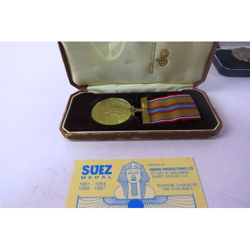 534 - National service and suez canal medals sgt mop gardner woman's voluntary service medal named