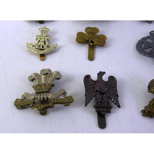 535 - Twelve military cap badges