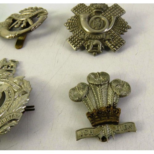 535 - Twelve military cap badges