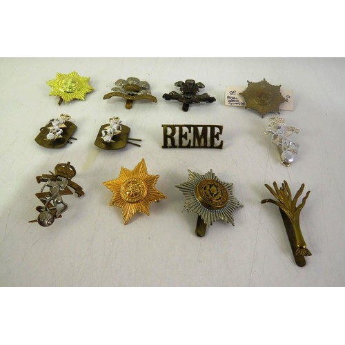 539 - Twelve military cap/ collar badges