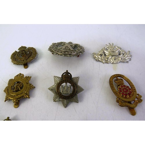 540 - Twelve military cap badges