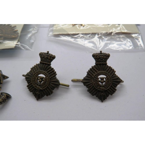 548 - 34 Military cap/Regiment badges