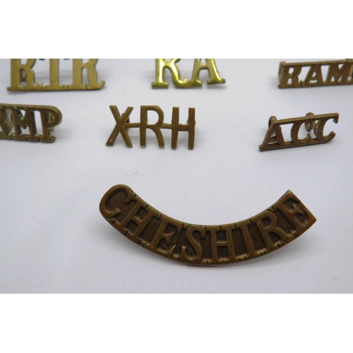 549 - 23 Military cap/Regiment badges