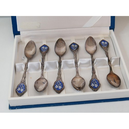 102 - Six enamel plated spoons - boxed