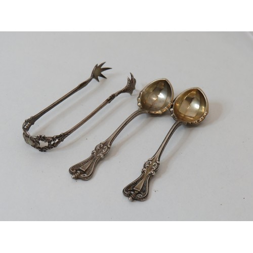 240 - Two silver spoons and silver tongs -38g