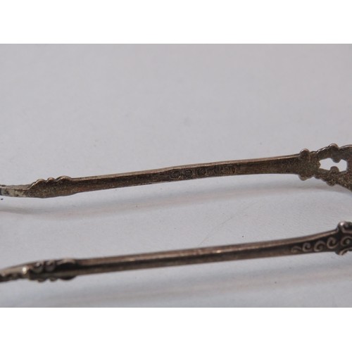 240 - Two silver spoons and silver tongs -38g