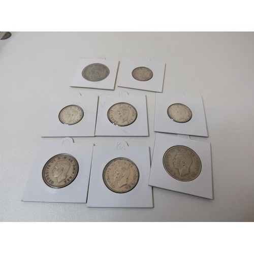 173 - Eight silver coins mounted including crowns