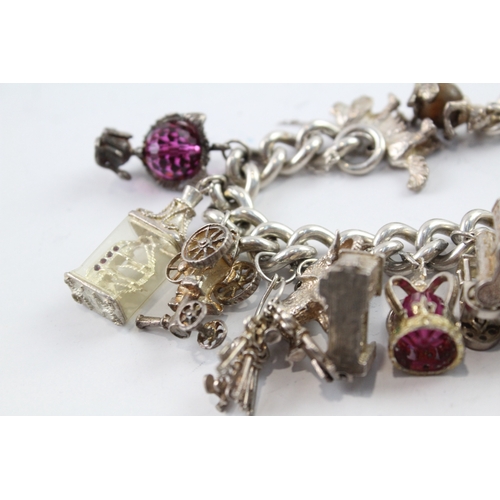 63 - Sterling Silver Charm Bracelet inc. Elephant, Crown, Bus, Trumpet 159g