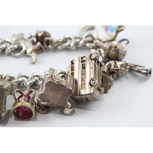 63 - Sterling Silver Charm Bracelet inc. Elephant, Crown, Bus, Trumpet 159g