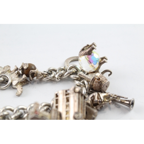 63 - Sterling Silver Charm Bracelet inc. Elephant, Crown, Bus, Trumpet 159g