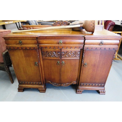 383 - 1930's carved oak sideboard with wine holder insert