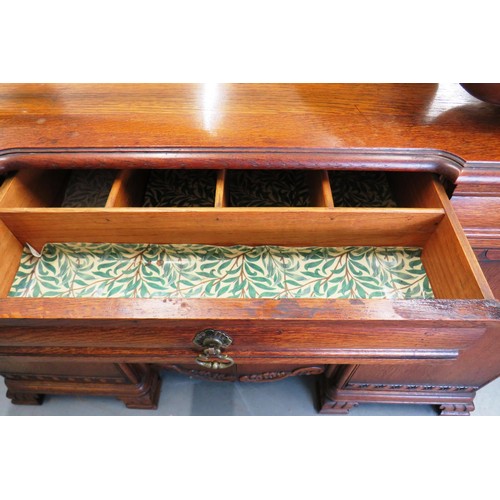 383 - 1930's carved oak sideboard with wine holder insert