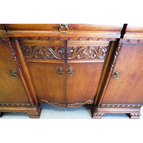 383 - 1930's carved oak sideboard with wine holder insert