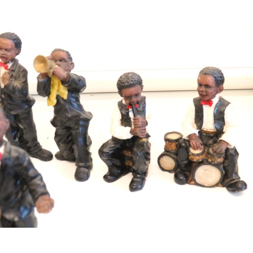 269 - Collection of seven resin jazz band figures.