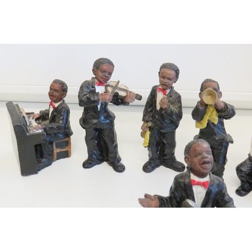 269 - Collection of seven resin jazz band figures.