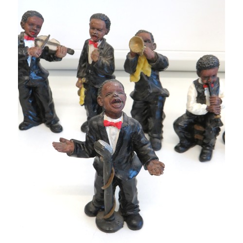 269 - Collection of seven resin jazz band figures.