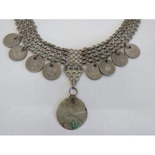 279 - Large oriental white metal coin necklace.