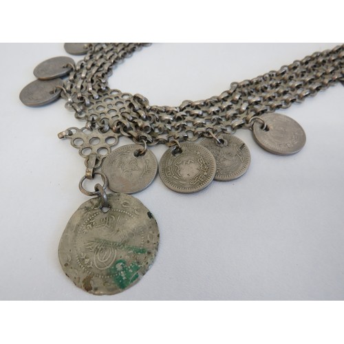 279 - Large oriental white metal coin necklace.