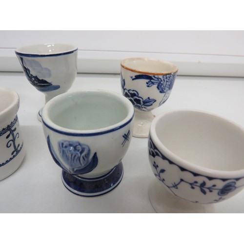 152 - Selection of blue & white egg cups to include Copeland Spode and Delft.