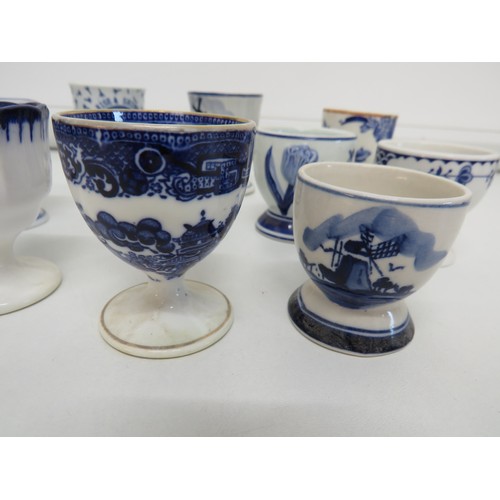 152 - Selection of blue & white egg cups to include Copeland Spode and Delft.