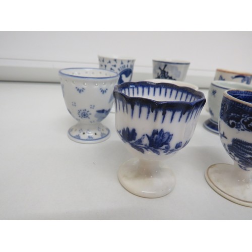 152 - Selection of blue & white egg cups to include Copeland Spode and Delft.