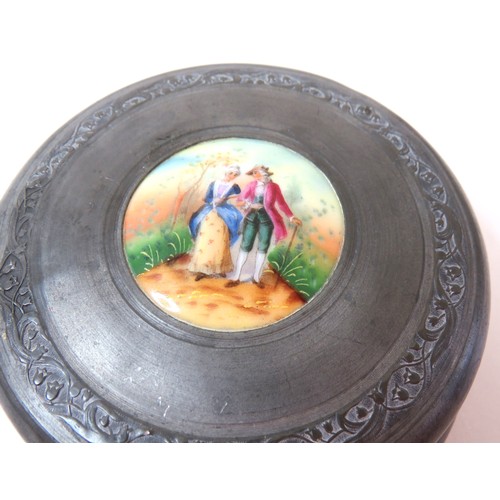 91 - Antique Victorian Aluminium vanity powder puff wind up music box with hand painted porcelain lid.
Wi... 