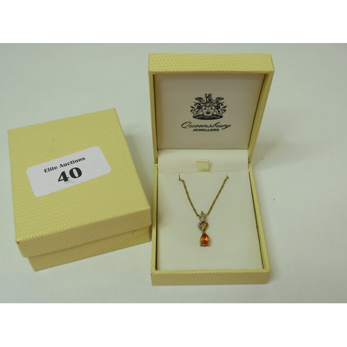 40 - 9ct Gold Topaz & Diamond pendant on 18