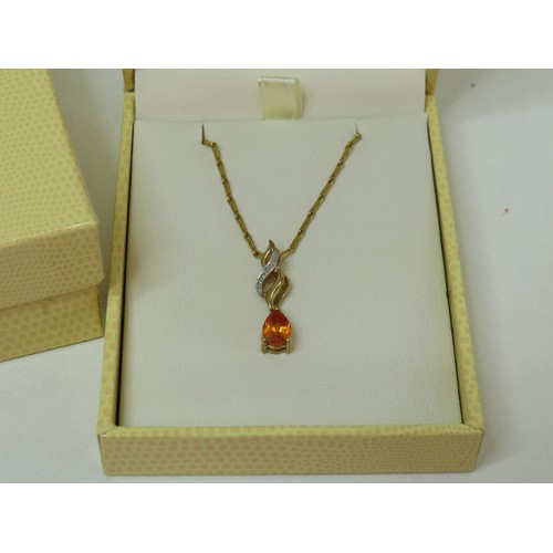 40 - 9ct Gold Topaz & Diamond pendant on 18