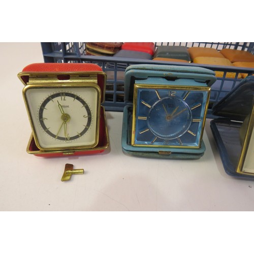 266 - Job lot of vintage travel alarm clocks.