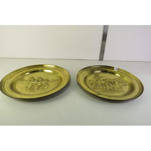 127 - Pair of large relief brass trays