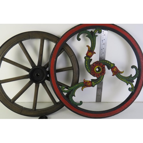 309 - Cast iron wheel wooden wheel and two horse restraints