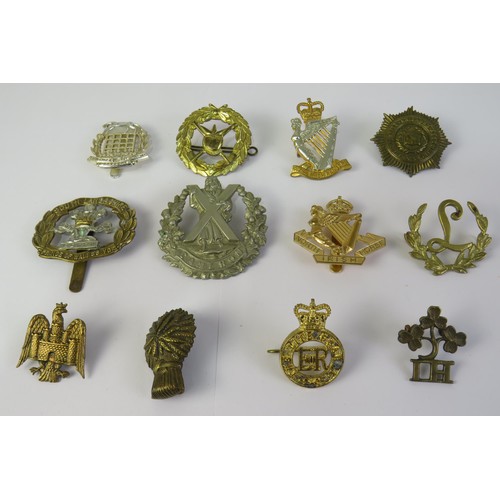 195 - Twelve military cap and collar badges