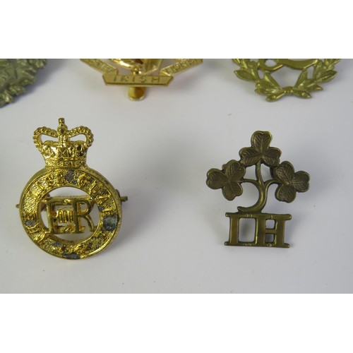 195 - Twelve military cap and collar badges