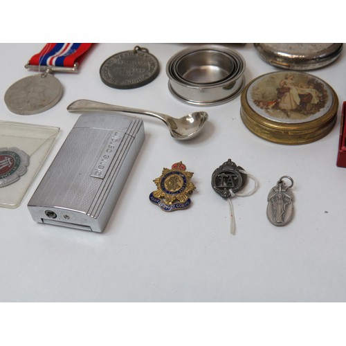 256 - Mixed lot of collectables to include silver spoon, medals, coins, cap badges, pierre cardin lighter ... 