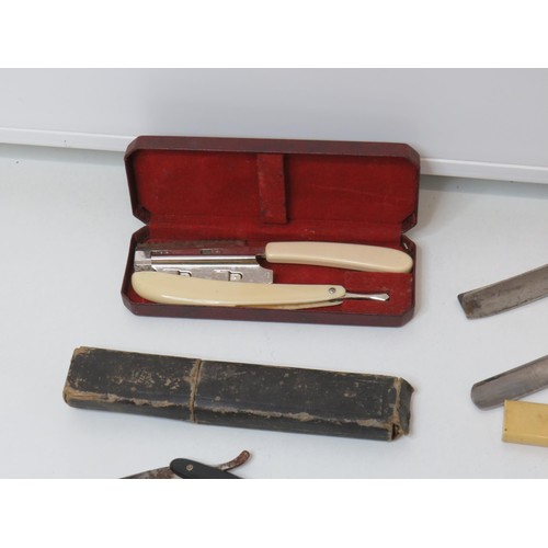 377 - Ten vintage Cut Throat Razors to include Piston cut Solingen etc.