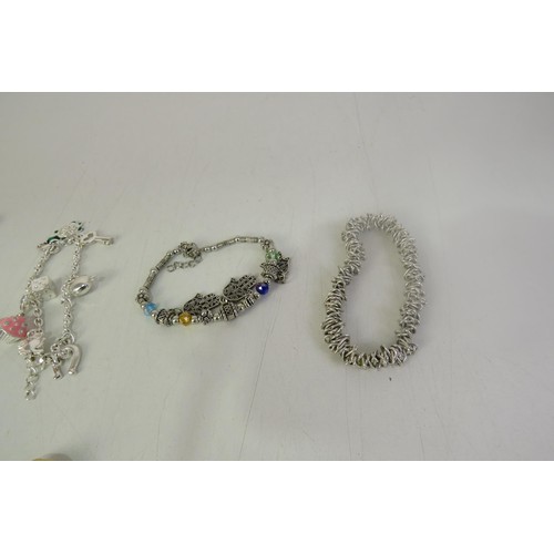 134 - Twelve charms bracelets including vintage