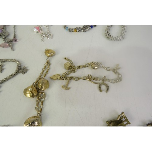 134 - Twelve charms bracelets including vintage