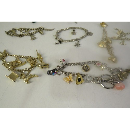 134 - Twelve charms bracelets including vintage